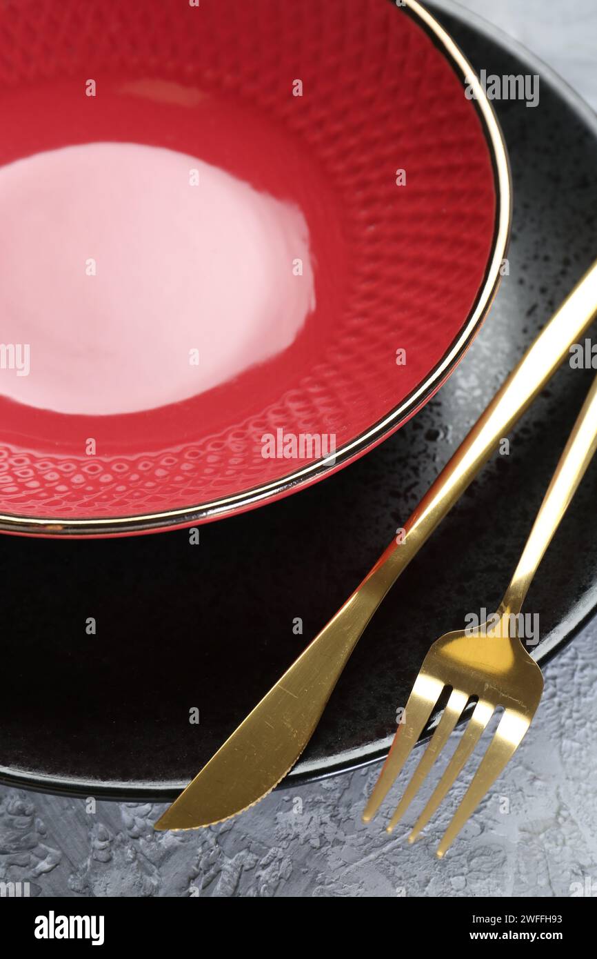 Clean plates, bowl and cutlery on table, closeup Stock Photo