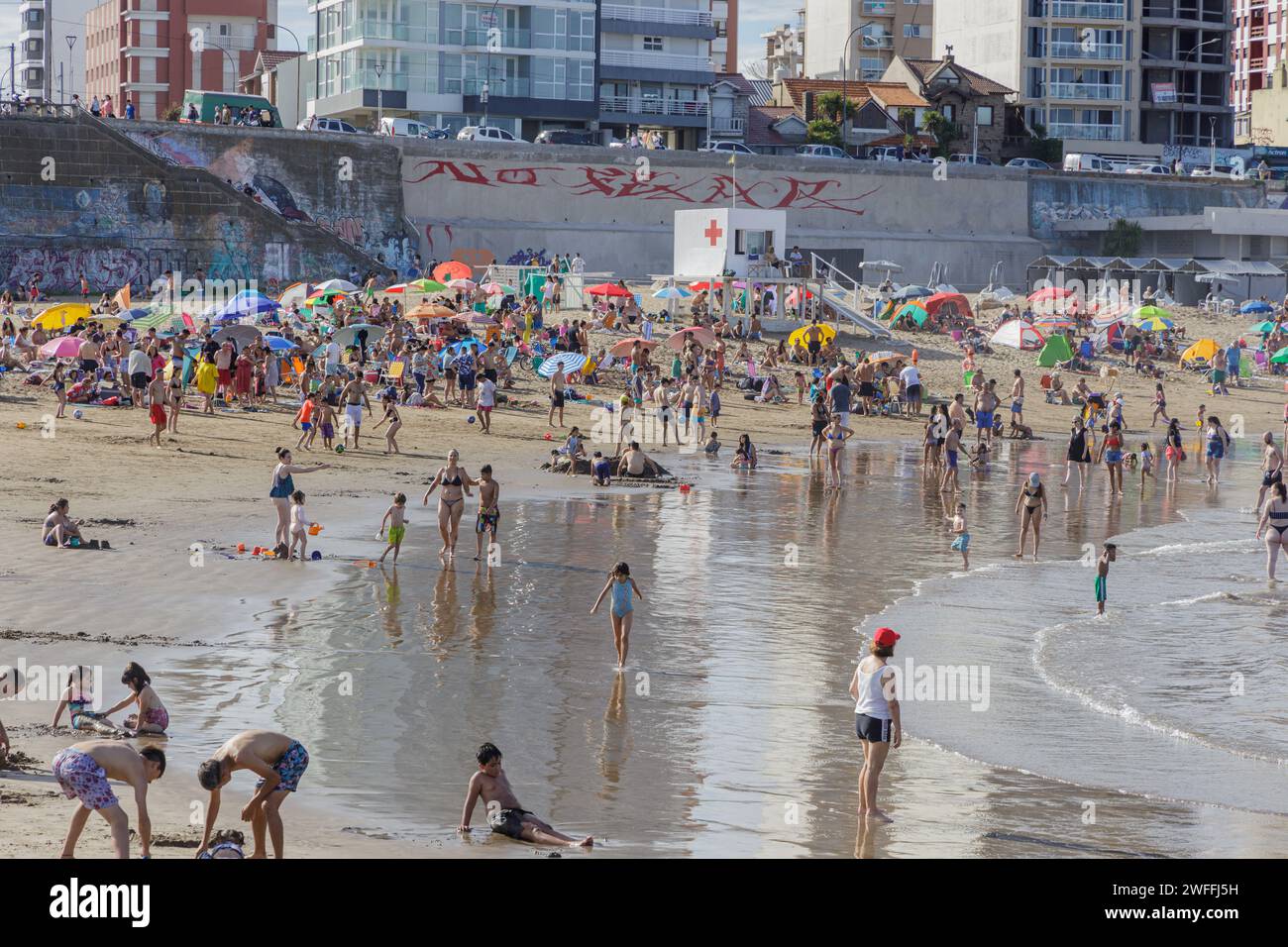 Mar del Plata, Argentina - January 15th, 2024: Tourists enjoy the sea at Stella Maris beach in Mar del Plata. Stock Photo