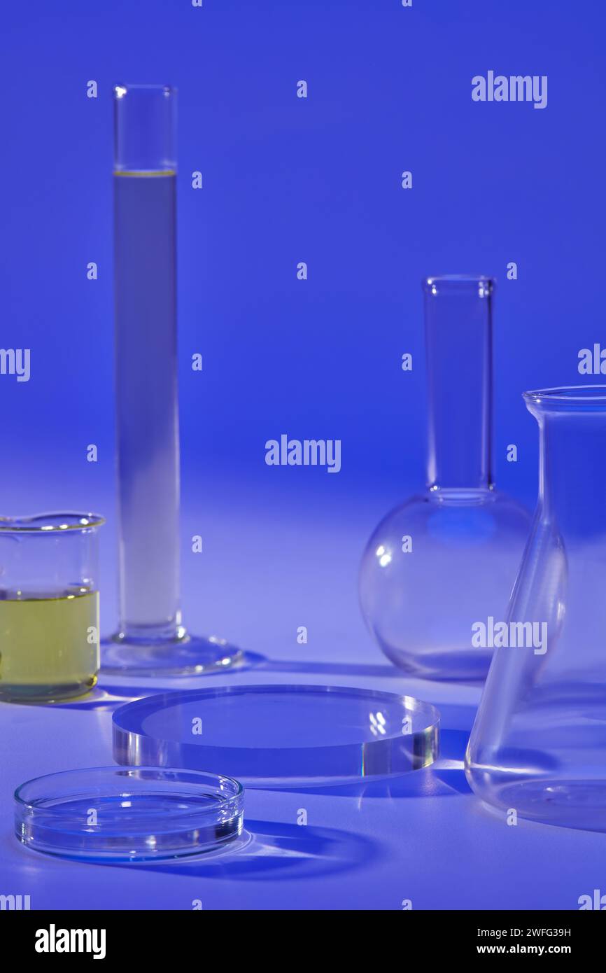 Lab Podium Over a blue background, several laboratory glassware are displayed with ...