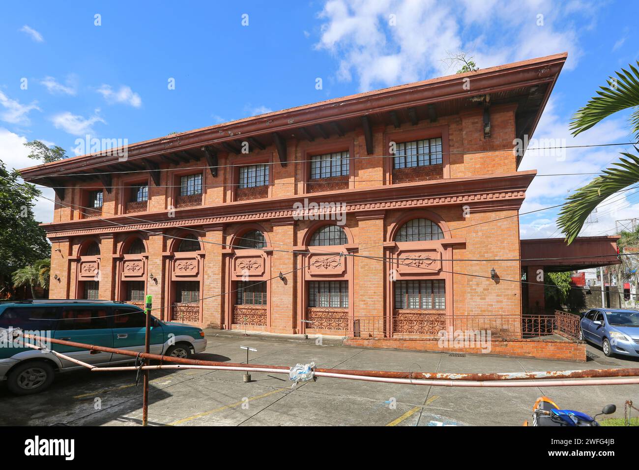 'Insular Life' insurance building in San Pablo, old architectural style with red bricks but built in 1992, Seven lakes city, Philippines architecture Stock Photo