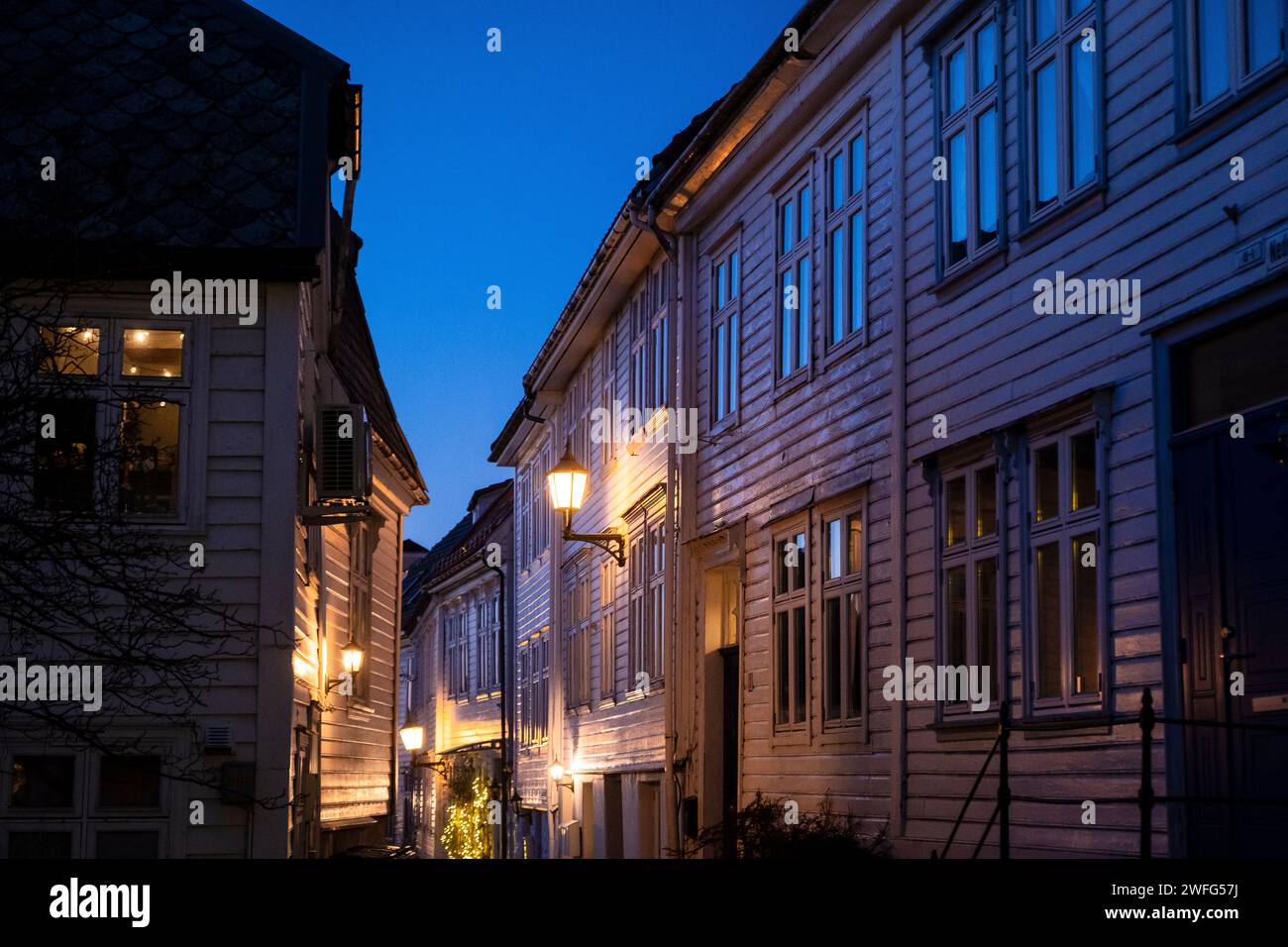 Narrow street in the Bergenhus neighborhood of Bergen, Norway Stock Photo