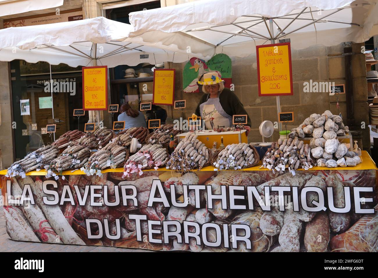 Stall at the Saturday market selling various sausage in Sarlat France Stock Photo