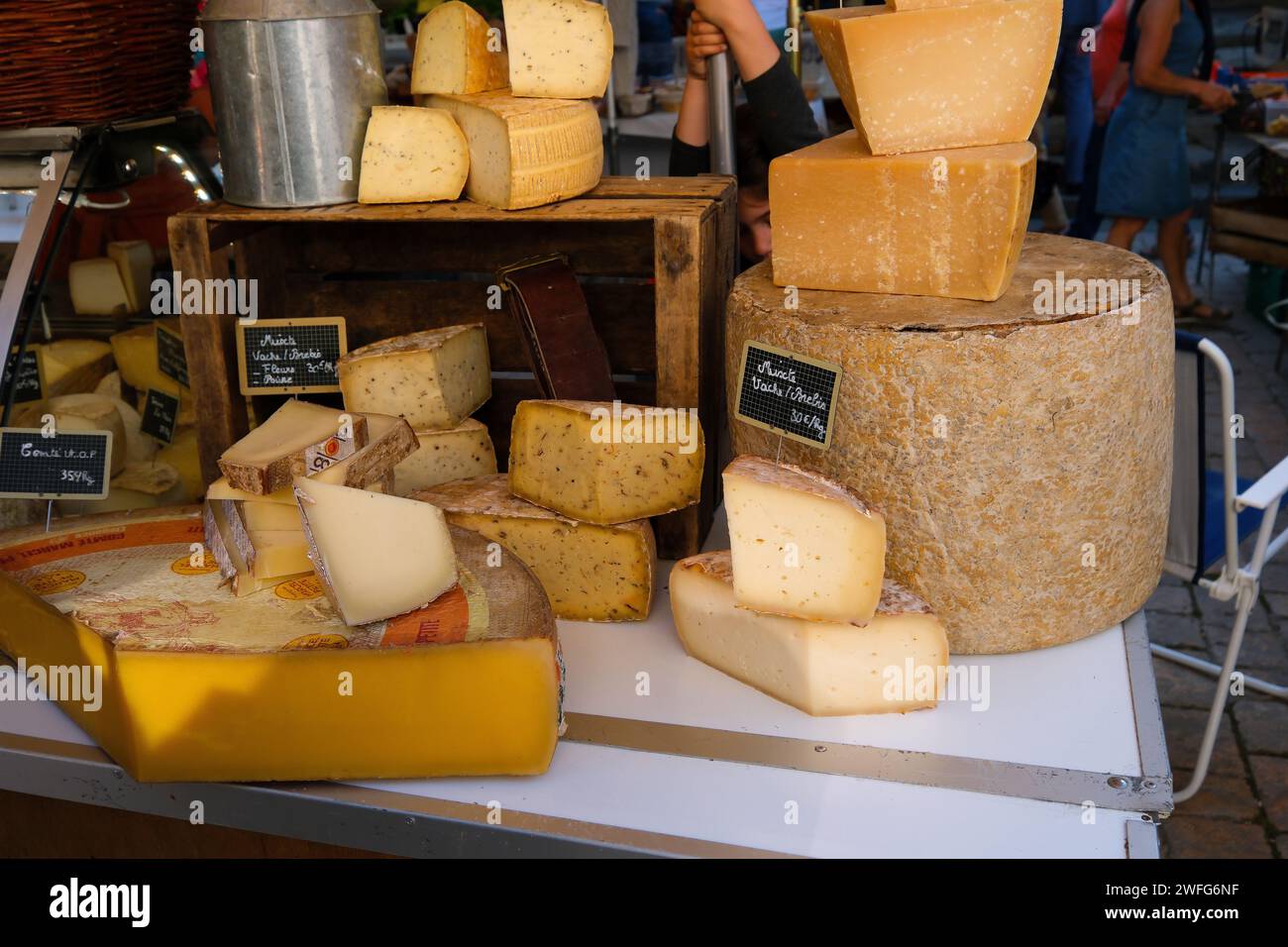 Stall at the Saturday market selling various local cheese in Sarlat France Stock Photo