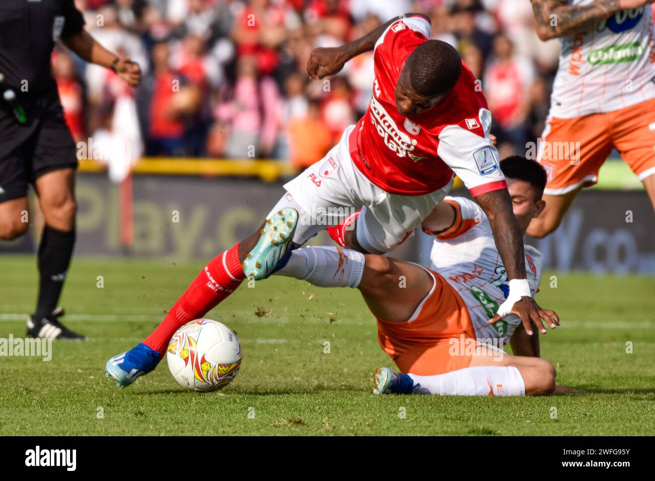 Bogota, Colombia. 27th Jan, 2024. Independiente Santa Fe's Daniel Moreno falls during a ball contest during the BetPlay Dimayor league match between Independiente Santa Fe (3) vs Envigado FC (1) on January 27, 2024, in Bogota, Colombia. Photo by: Cristian Bayona/Long Visual Press Credit: Long Visual Press/Alamy Live News Stock Photo