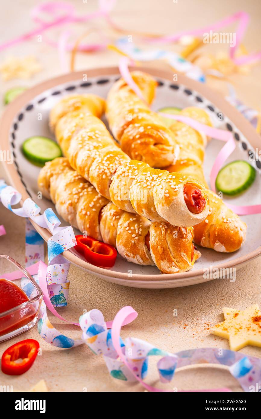 Pig in blanket, long sausages wrapped in yeast dough traditional