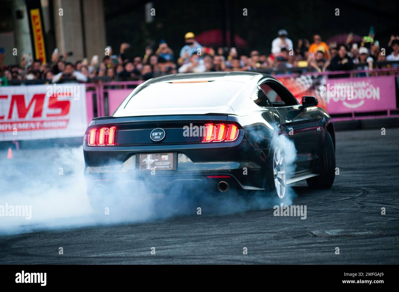 Bogota, Colombia. 28th Jan, 2024. A Ford Mustang does a donut show during the MCM Show 2024 in Bogota, Colombia where automobile fans and collectors gather to appreciate Colombia's car culture around tuning, supercars and classics, january 28, 2024. Photo by: Chepa Beltran/Long Visual Press Credit: Long Visual Press/Alamy Live News Stock Photo