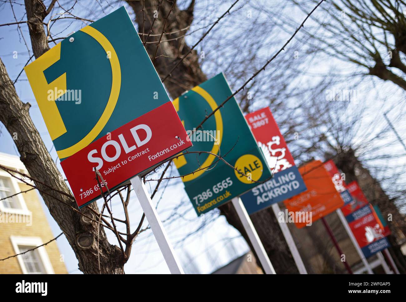 File photo dated 1/3/2015 of a row of Sold, For Sale and Let By signs displayed outside houses in Clapton, east London. Nearly two-thirds of people taking their first step on the property ladder are doing so with someone else, according to a mortgage lending giant. Some 63% of first-time buyer mortgages taken out between January and December 2023 were in joint names, involving two or more people, Halifax found. Issue date: Wednesday January 31, 2024. Stock Photo
