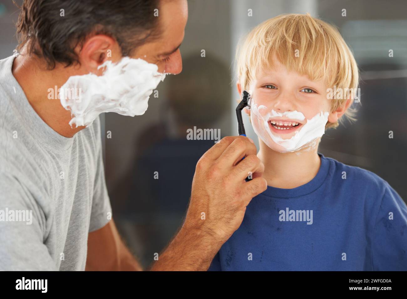 Shaving, dad and child with cream, razor on face and bonding in home ...