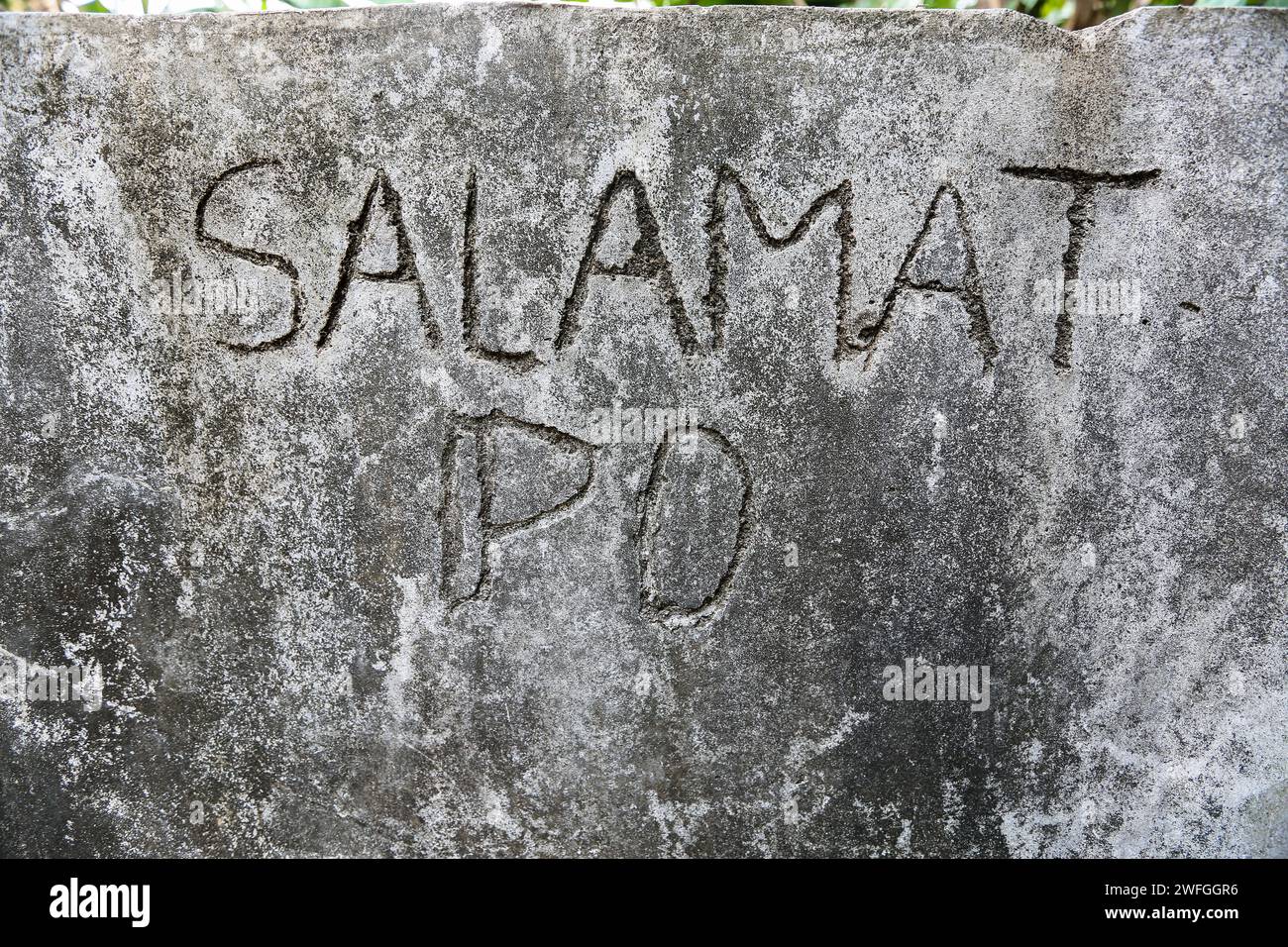 Wall engraved 'Salamat po' meaning thank you in Tagalog, official language (with English) spoken in the Philippines, thanks the visitors of a barangay Stock Photo