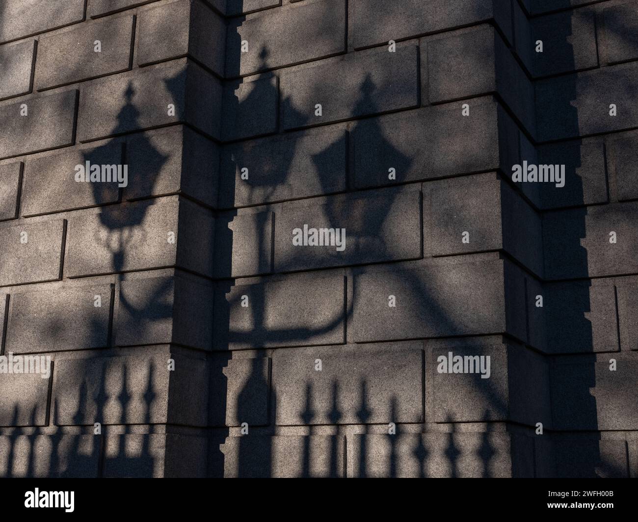 A silhouette of ornate street lighting on a wall. Dublin city, Ireland. Stock Photo