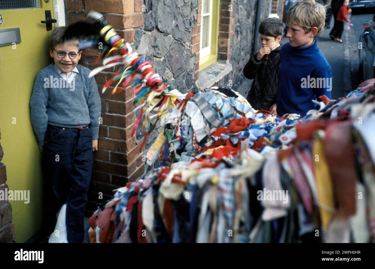 1980s boy UK, wearing old fashioned regulation National Health Service spectacles. Minehead Sailors Horse bows three times to him. An annual local May Day folk custom. Minehead, Somerset England UK. 1980s HOMER SYKES Stock Photo