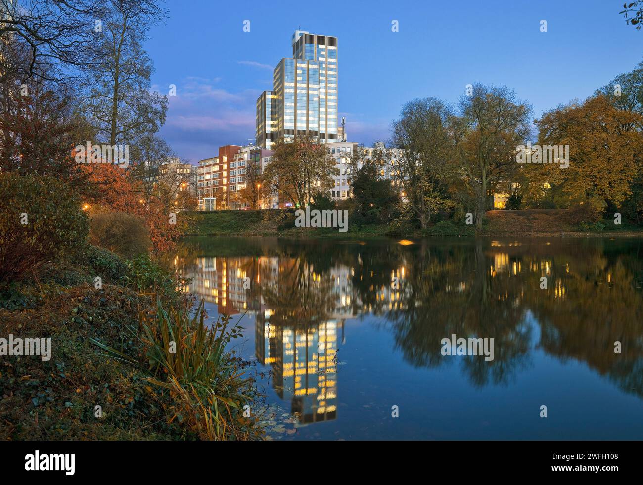 LVA main building reflected in pond Kaiserteich in the fall in the evening, Germany, North Rhine-Westphalia, Lower Rhine, Dusseldorf Stock Photo