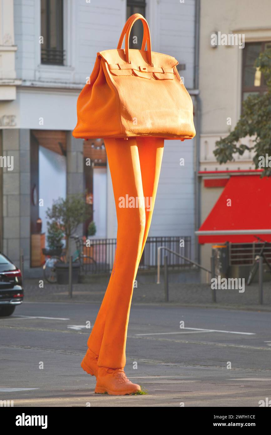 Bronze sculpture Walking Bag at the entrance to the city's shopping area, Germany, North Rhine-Westphalia, Bonn Stock Photo