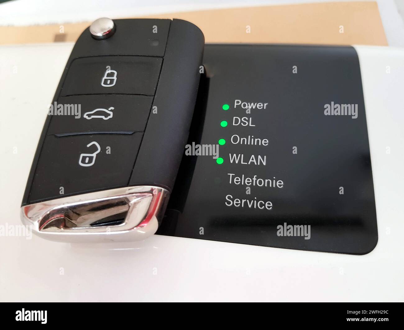 Car key and router, symbol for emobility Stock Photo Alamy