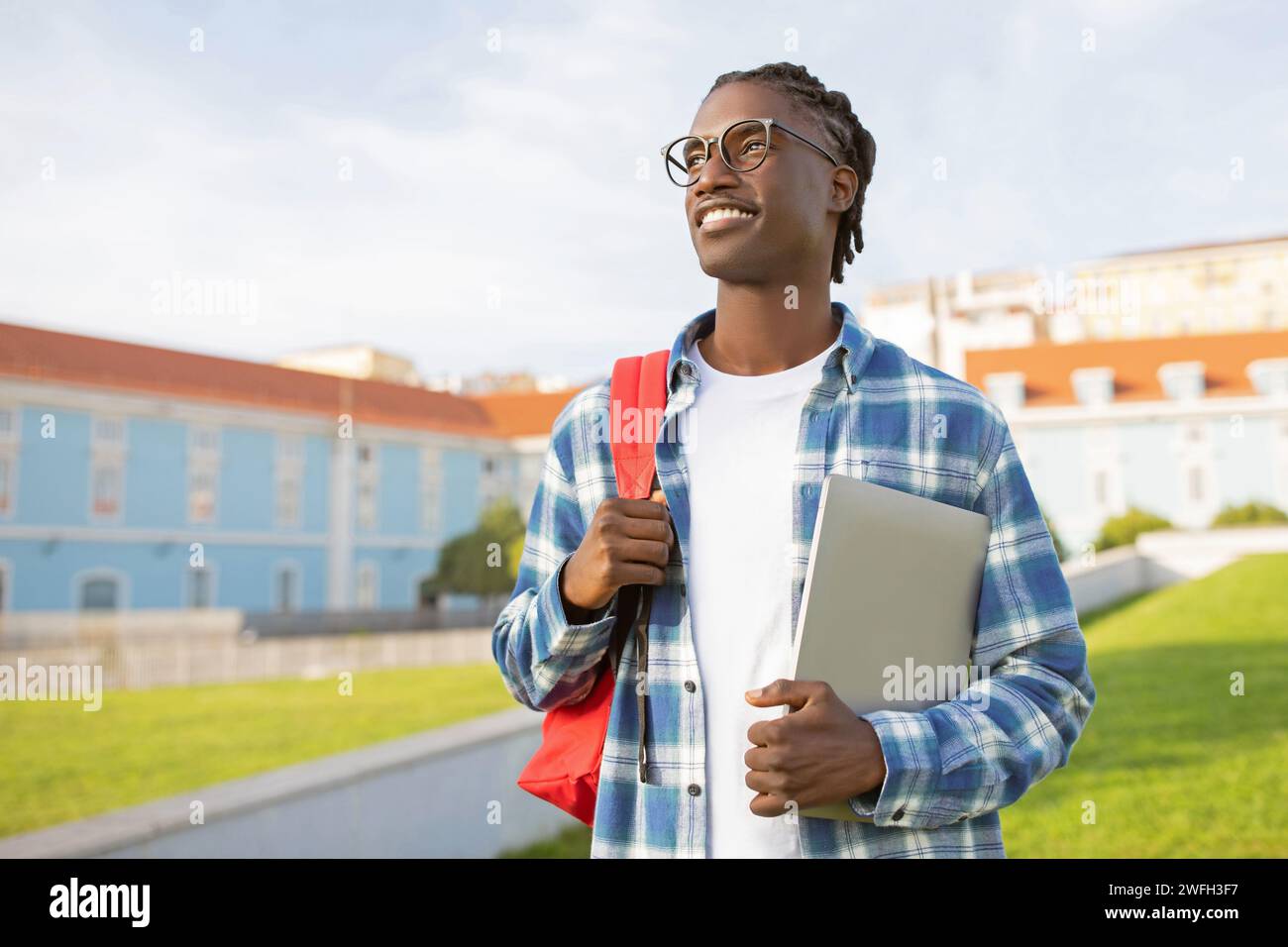 Black Student Guy With Backpack And Laptop Over University Campus Stock ...