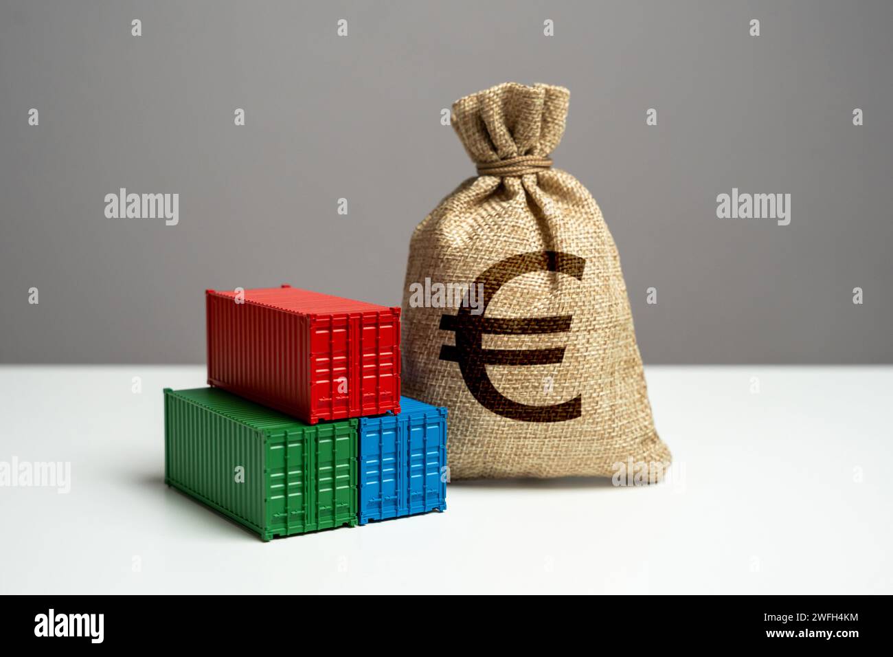 Stack of shipping containers and euro money bag. Trade, economics and transport industry