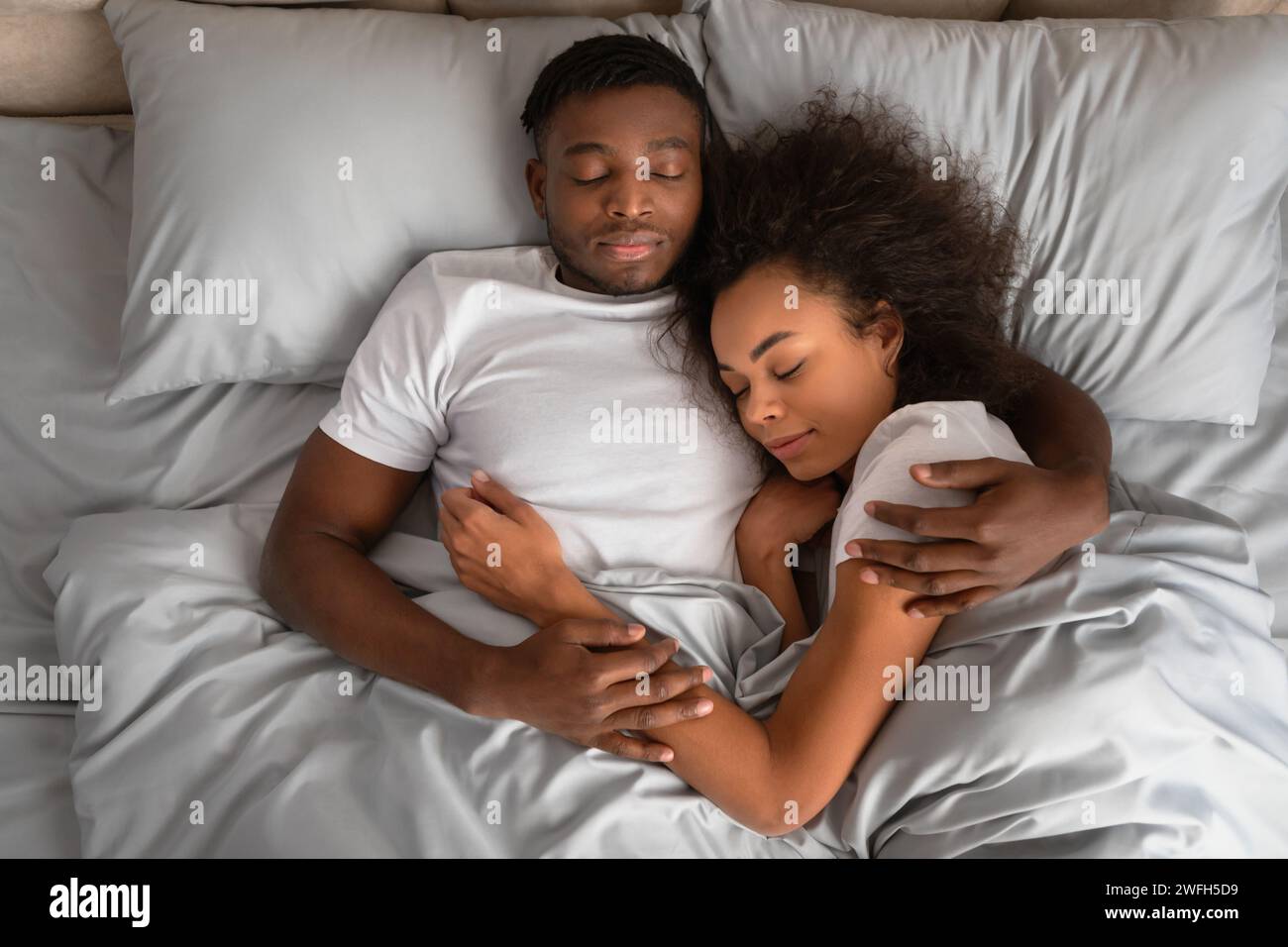 Two Spouses Two young spouses lying together hi-res stock photography and images ...