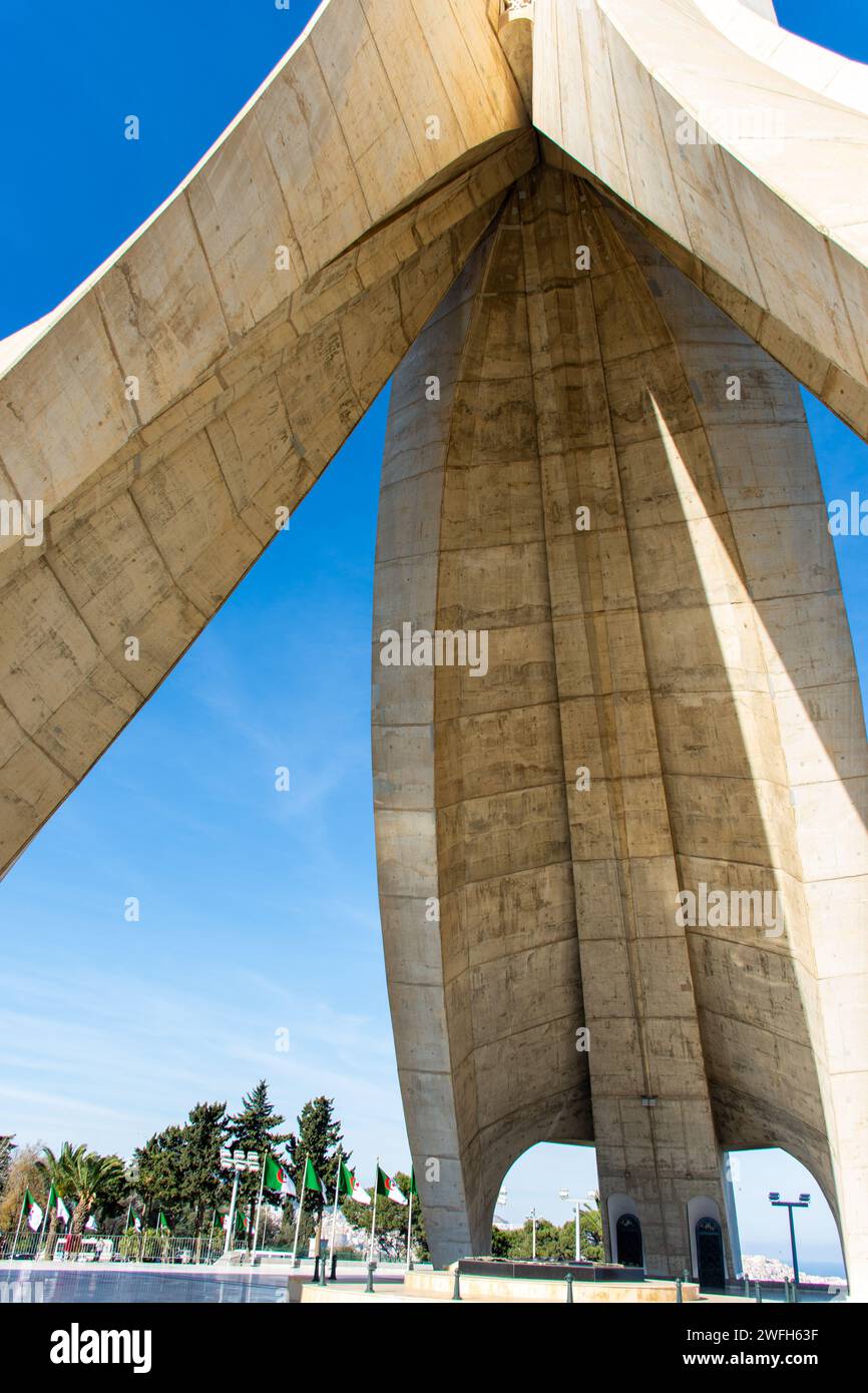 Low-angle view of Maqam Echahid monument the famous landmark in Algeria against a blue sky. Stock Photo