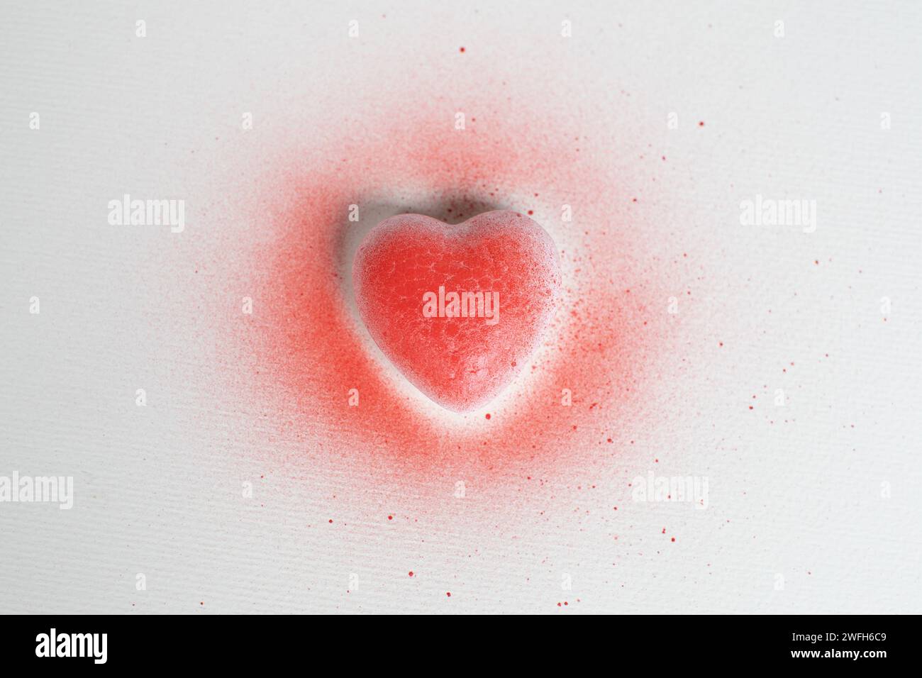 spray painted red heart on white background Stock Photo