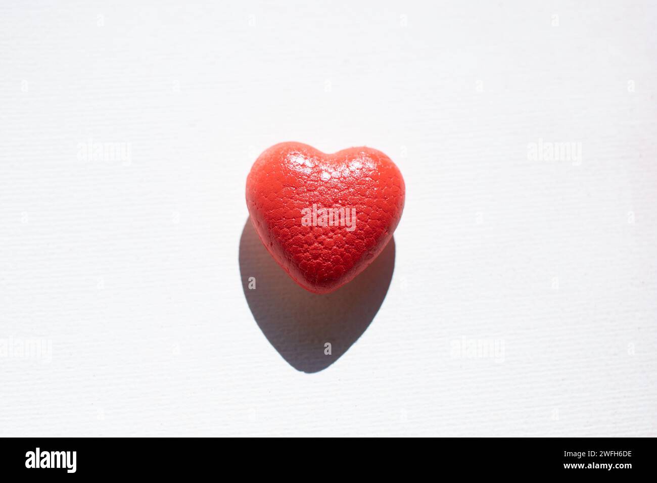 spray painted red heart on white background Stock Photo