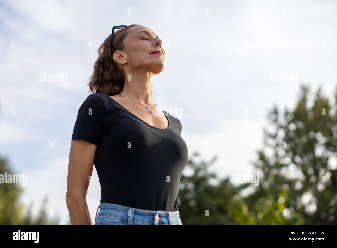 woman enjoying a beautiful day outdoors Stock Photo - Alamy