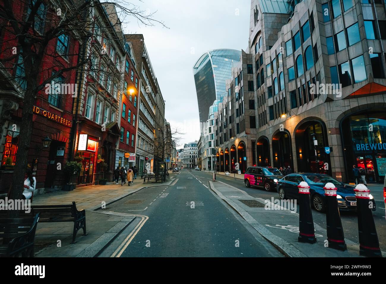 The cars driving on a bustling city street in downtown London Stock Photo