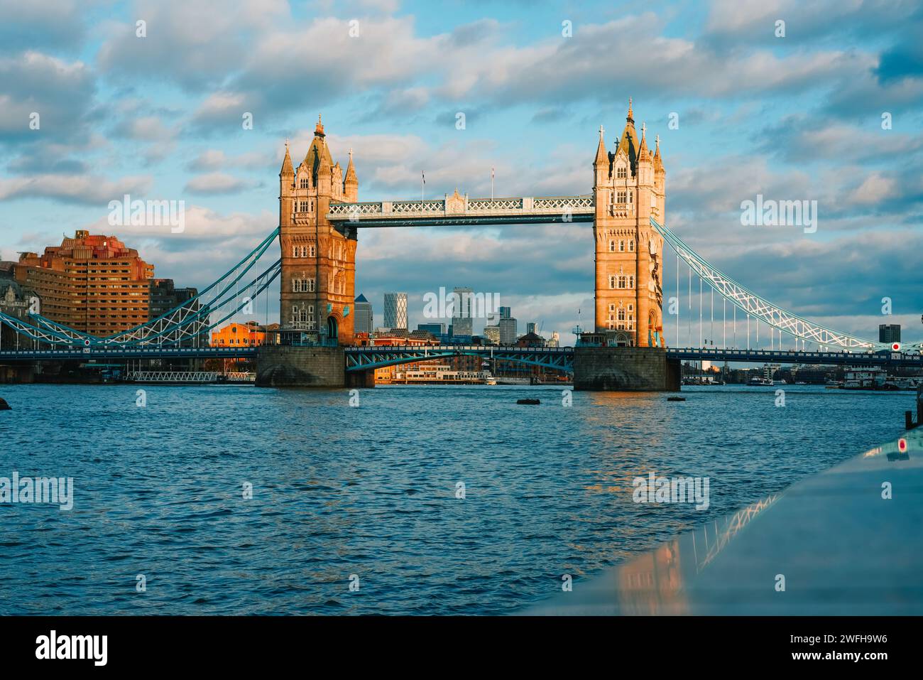 The historic Tower Bridge spanning over calm waters  in London, UK Stock Photo