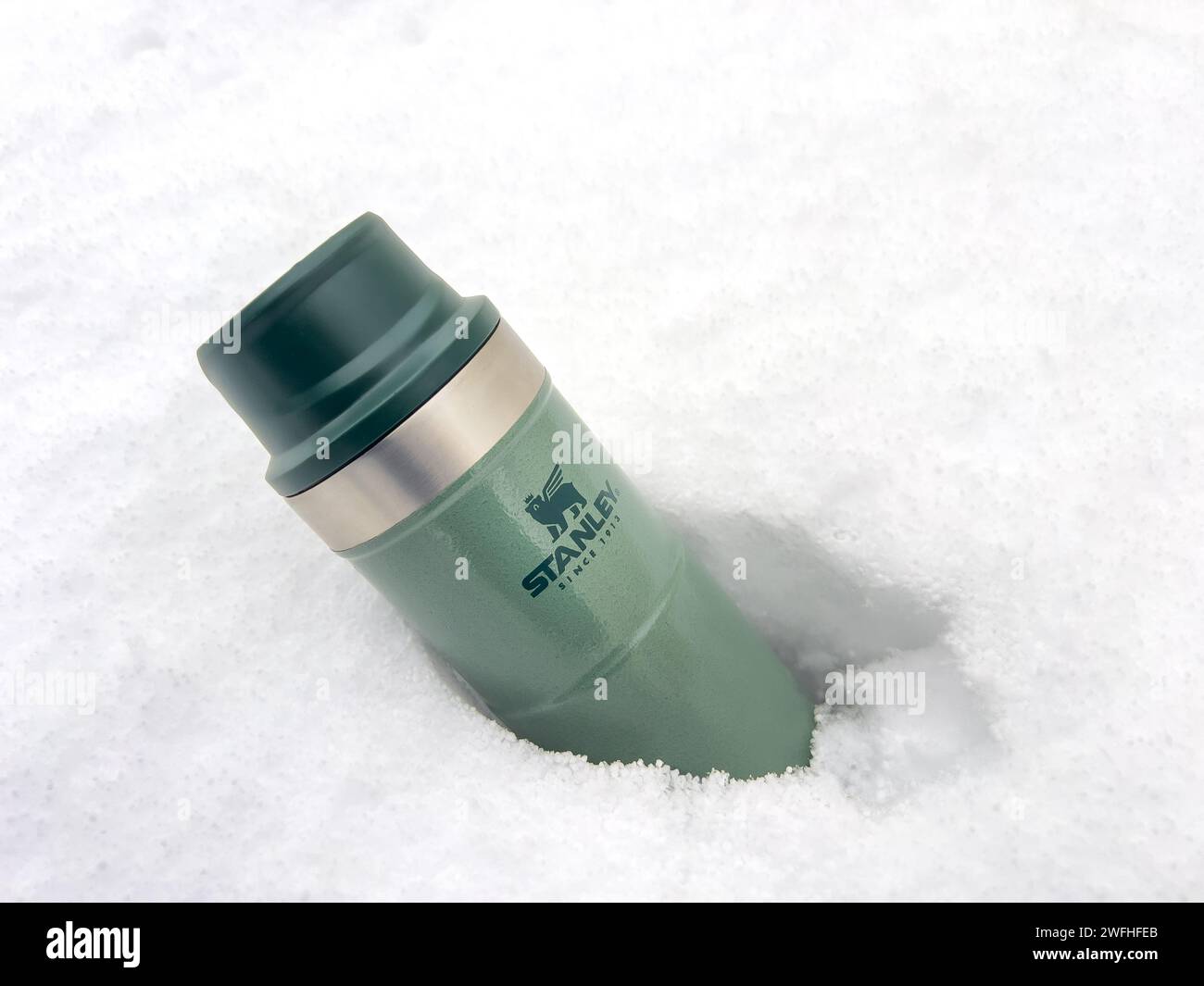 Antalya, Turkey - January 31, 2024: Stanley Action Trigger thermos mug standing in the snow in winter Stock Photo