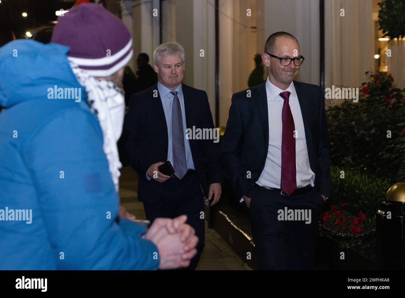 London, UK. 30th January, 2024. Guests arriving at the JW Marriott Grosvenor House Hotel for the ADS Annual Dinner encounter a protest by campaigners against the arms trade. The ADS Annual Dinner brings together representatives of companies from the UK's aerospace, defence, security and space industries. Sponsors of the event include BAE Systems which supplies components for F-35 combat aircraft used by Israel during its invasion of Gaza. Credit: Mark Kerrison/Alamy Live News Stock Photo