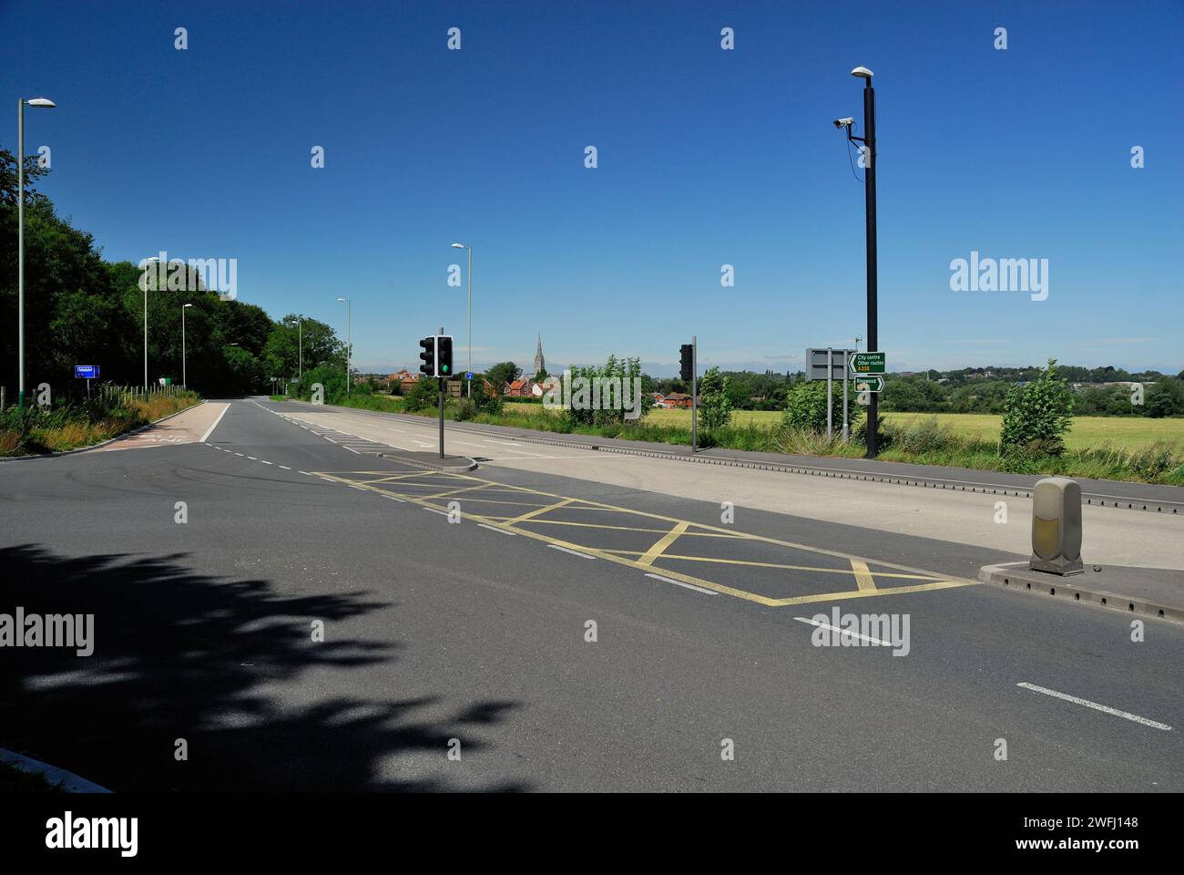 Road junction at the entrance to the car park at Britford Park and Ride, near Salisbury, Wiltshire. Stock Photo
