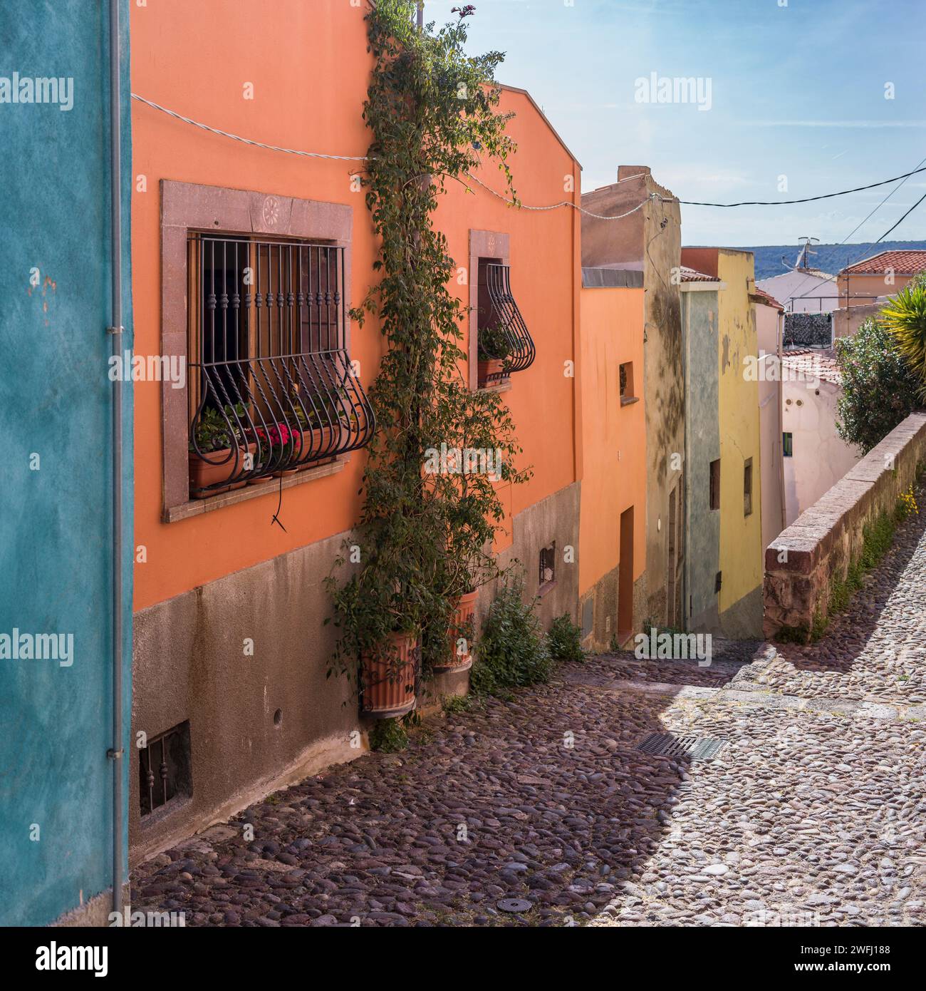 Row of buildings along a street in the Town of Bosa, Sardinia, Italy Stock Photo