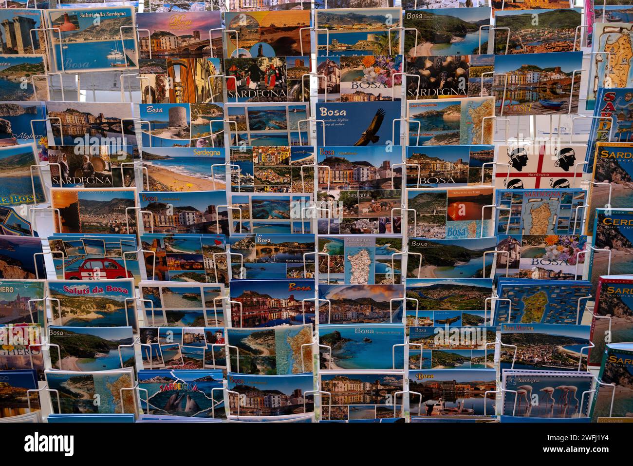 Display rack of postcards in the town of Bosa which is situated about two-thirds of the way up the west coast of Sardinia, Italy Stock Photo