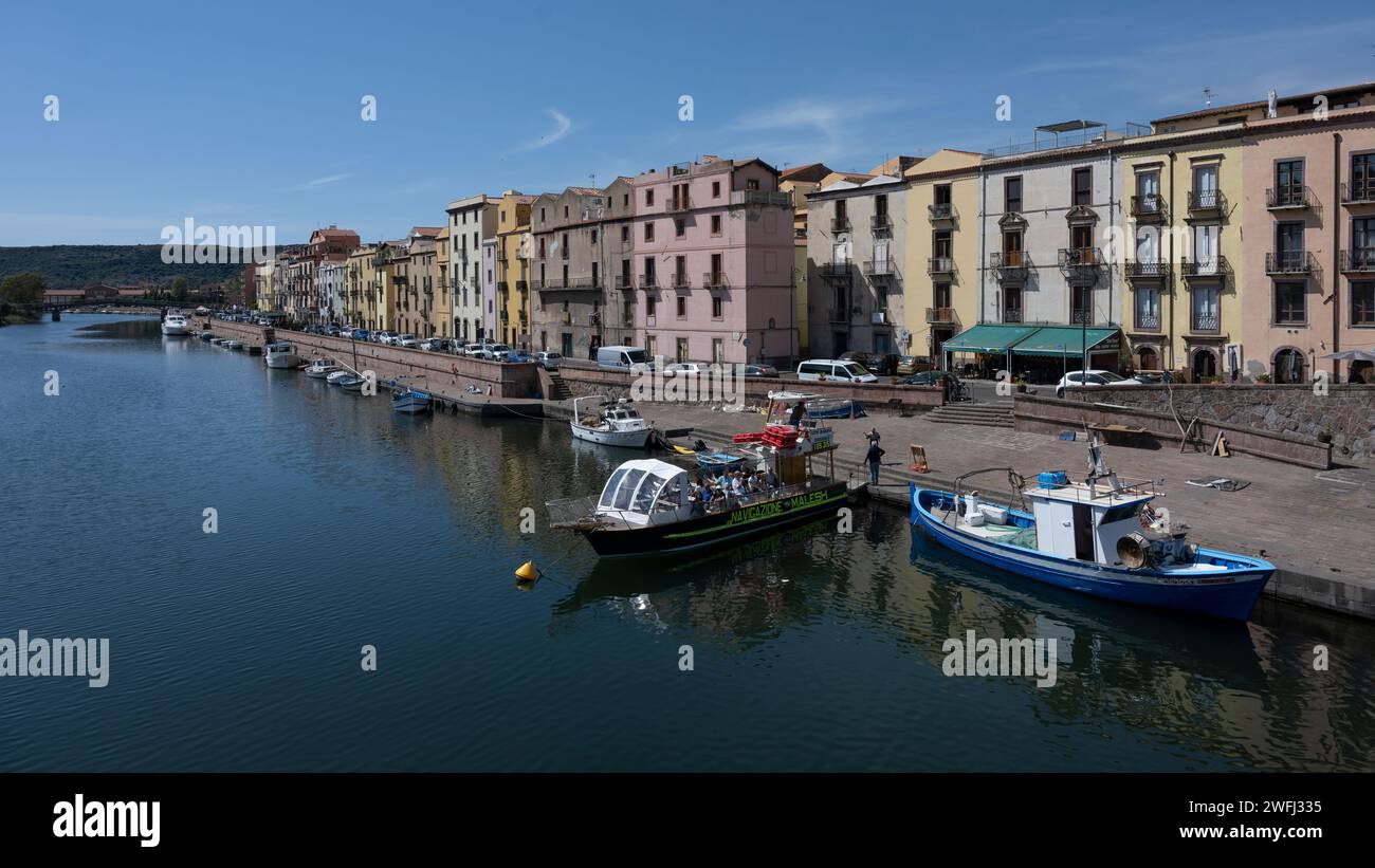 Boats docked along the coastline of the town of Bosa is situated about two-thirds of the way up the west coast of Sardinia, Italy Stock Photo