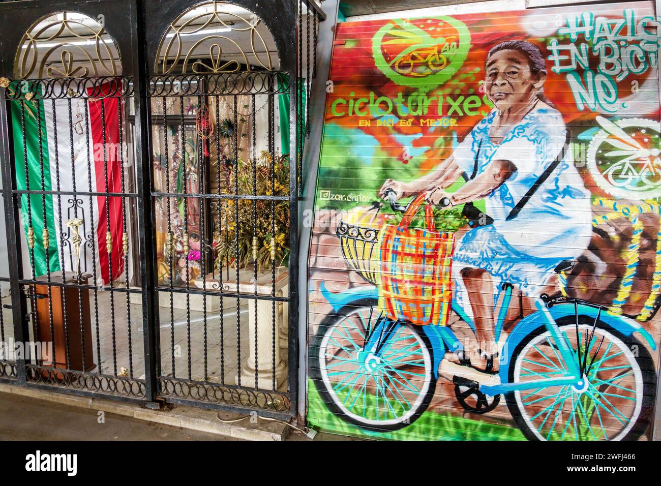 Merida Mexico,Zona Paseo Montejo Centro,Cicloturixes Mayan mural promoting bicycle riding,hanging flag,Mexican Hispanic Latin Latino,Spanish speaking Stock Photo