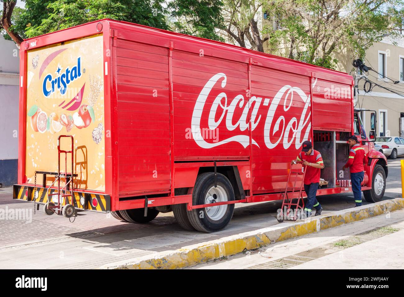 Merida Mexico,Zona Paseo Montejo Centro,Coca-Cola Cristal delivery truck van,man men male,adult adults,resident residents,employees working,Calle 47,s Stock Photo