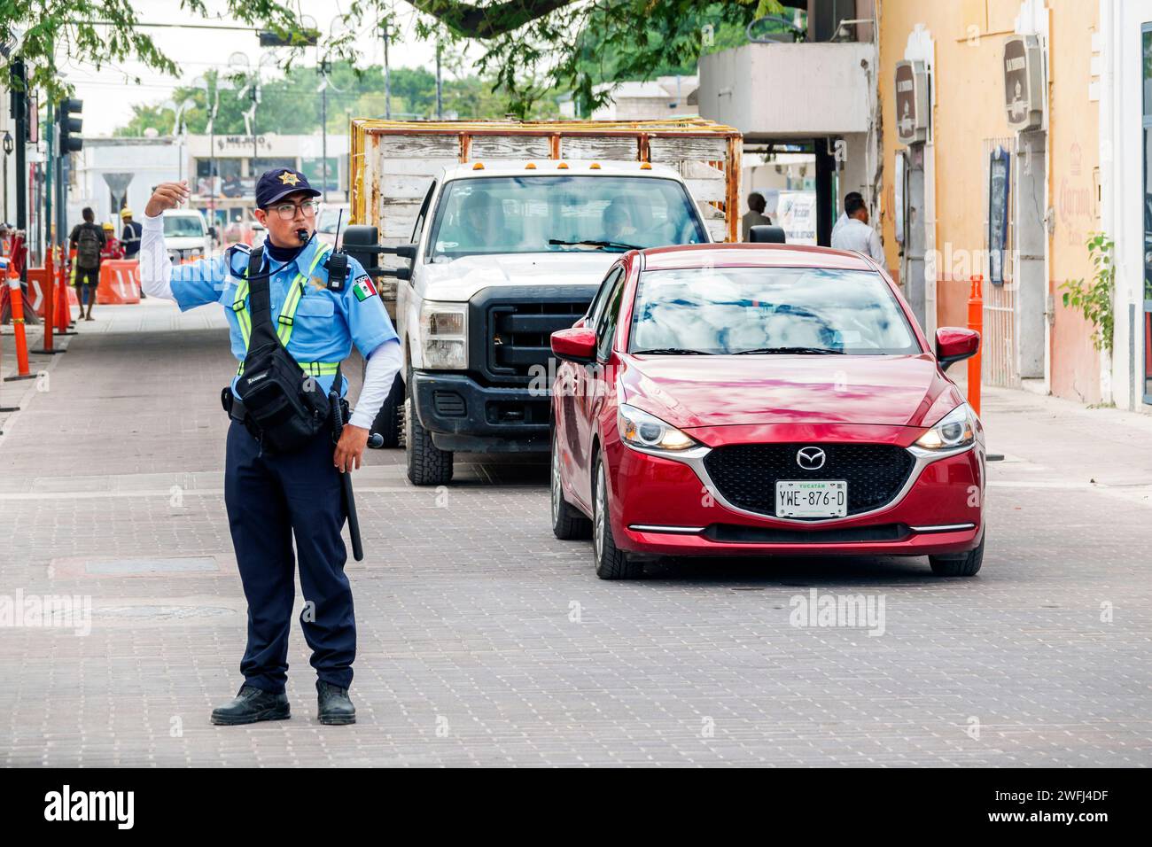 Merida Mexico,Zona Paseo Montejo Centro,police policeman directing traffic control officer,man men male,adult adults,resident residents,employee emplo Stock Photo