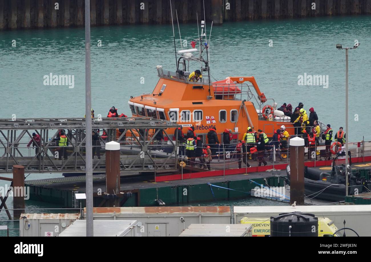 A group of people thought to be migrants are brought in to Dover, Kent, from the RNLI Dover Lifeboat following a small boat incident in the Channel. Picture date: Wednesday January 31, 2024. Stock Photo