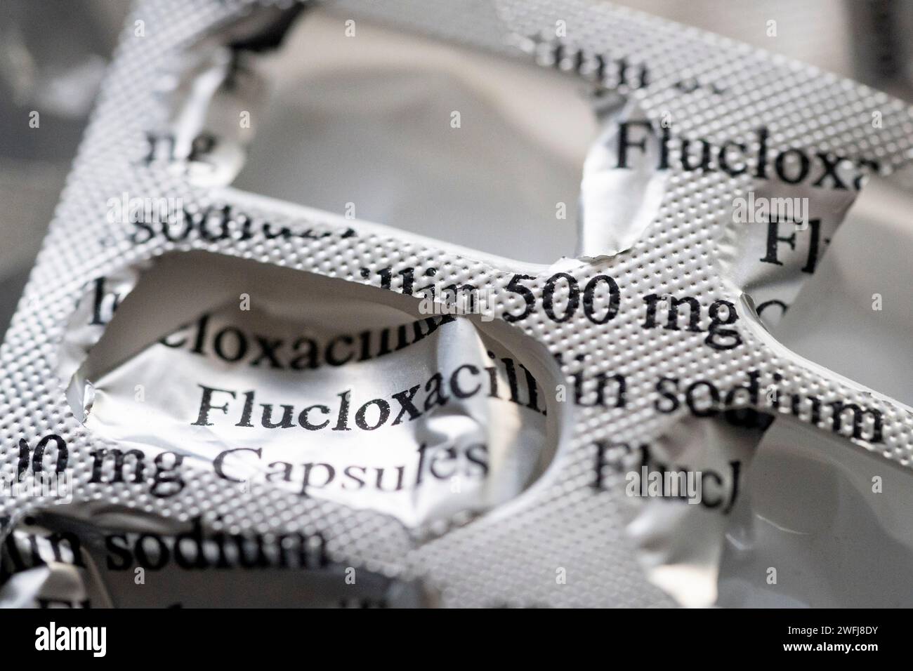 A detail of silver medication foils that once contained 500mg Flucloxacillin capsules pharmaceutical products, on 31st January 2024, in London, England. Flucloxacillin is an antibiotic that belongs to a group of medicines called penicillins. Stock Photo