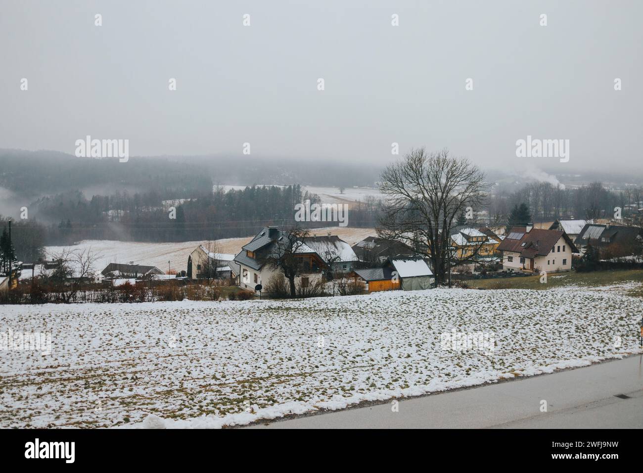 A winter landscape showing a snowy village Stock Photo