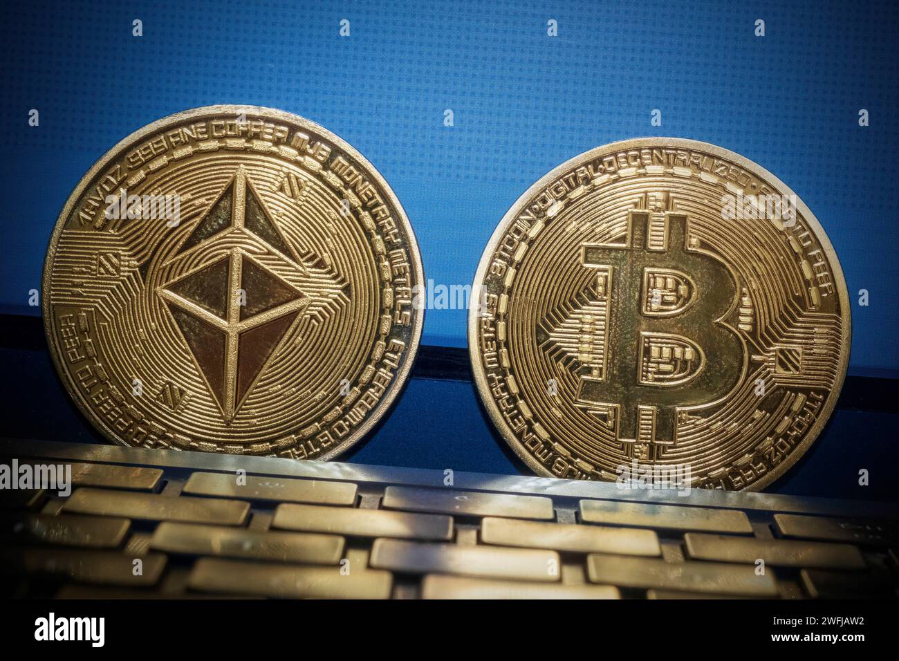 Ethereum and Bitcoin coin on a laptop Stock Photo