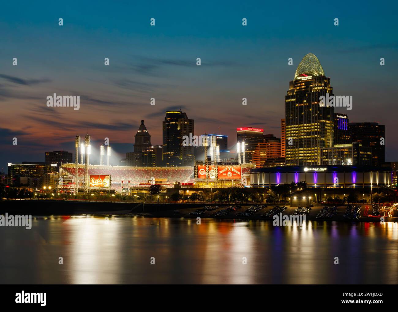 Cincinnati, Ohio, skyline. Cincinnati Reds baseball sign and stadium near center. Viewed across the Ohio River from Newport, Kentucky, USA. Stock Photo