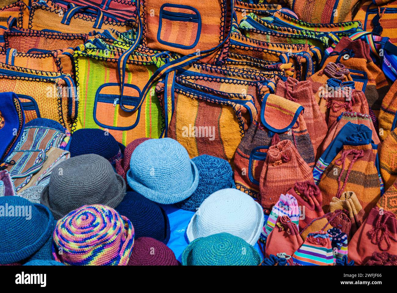Crochet hats, bags and luggage in a peruvian street market Stock Photo