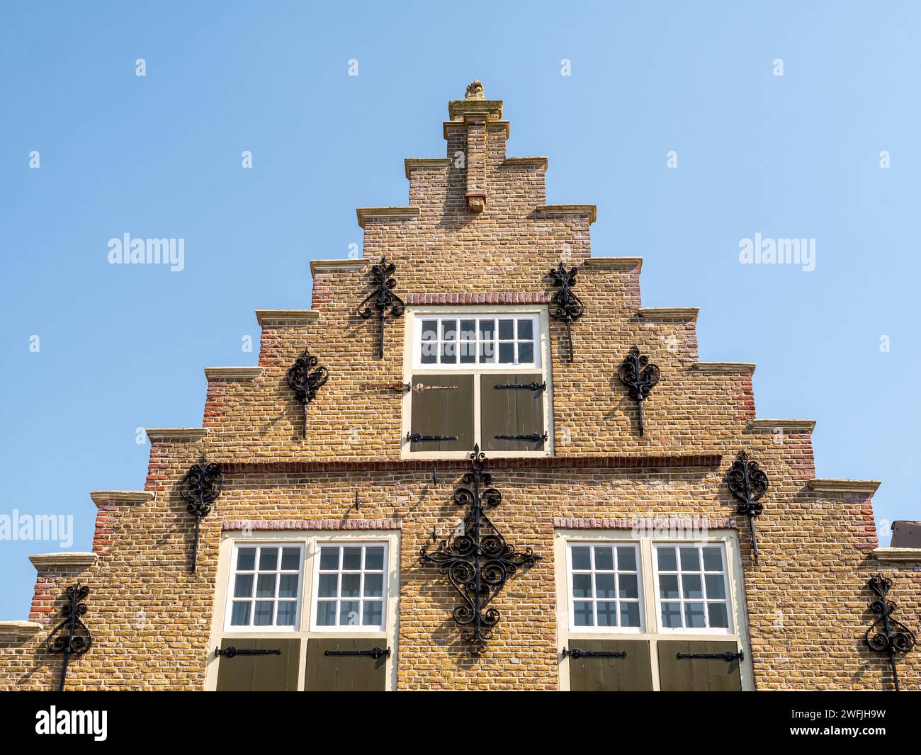 Stepped gable of house in Voorstraat in old town of Sint-Annaland, Tholen, Zeeland, Netherlands Stock Photo