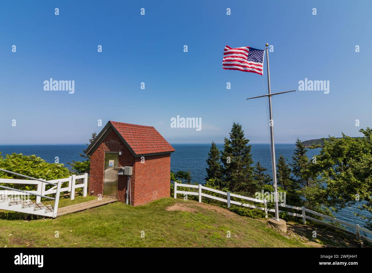 Owls Head Lighthouse in Rockland Maine USA on a clear sunny summer day with blue sky Stock Photo