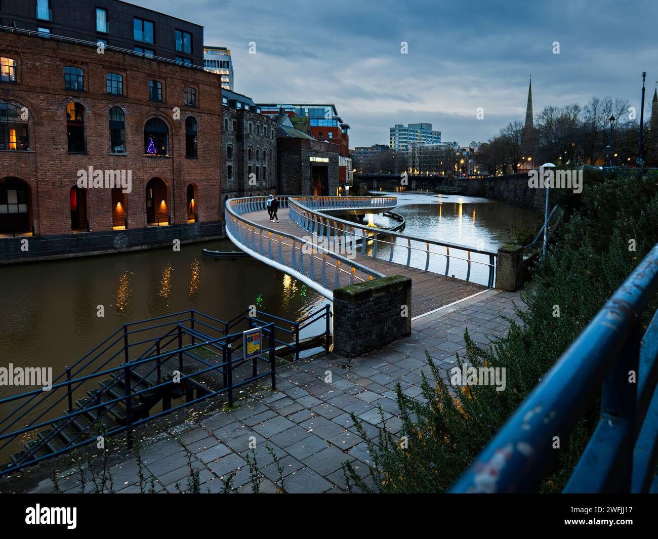 Modern, winding, bridge at dusk over the river Avon, Bristol, UK Stock Photo