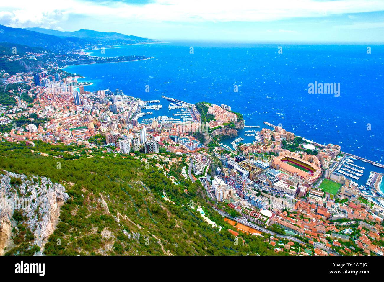 A stunning coastal city nestled between majestic mountains and the ...