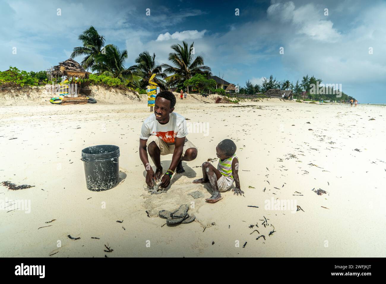 fisherman with his son catching octopus. Zanzibar Stock Photo - Alamy