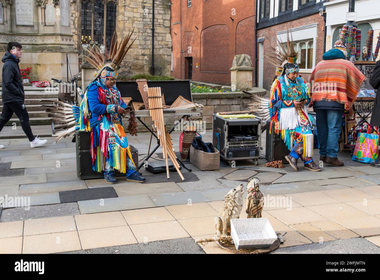 Two Inca performers taking break, High Street, Lincoln City, Lincolnshire, England, UK Stock Photo