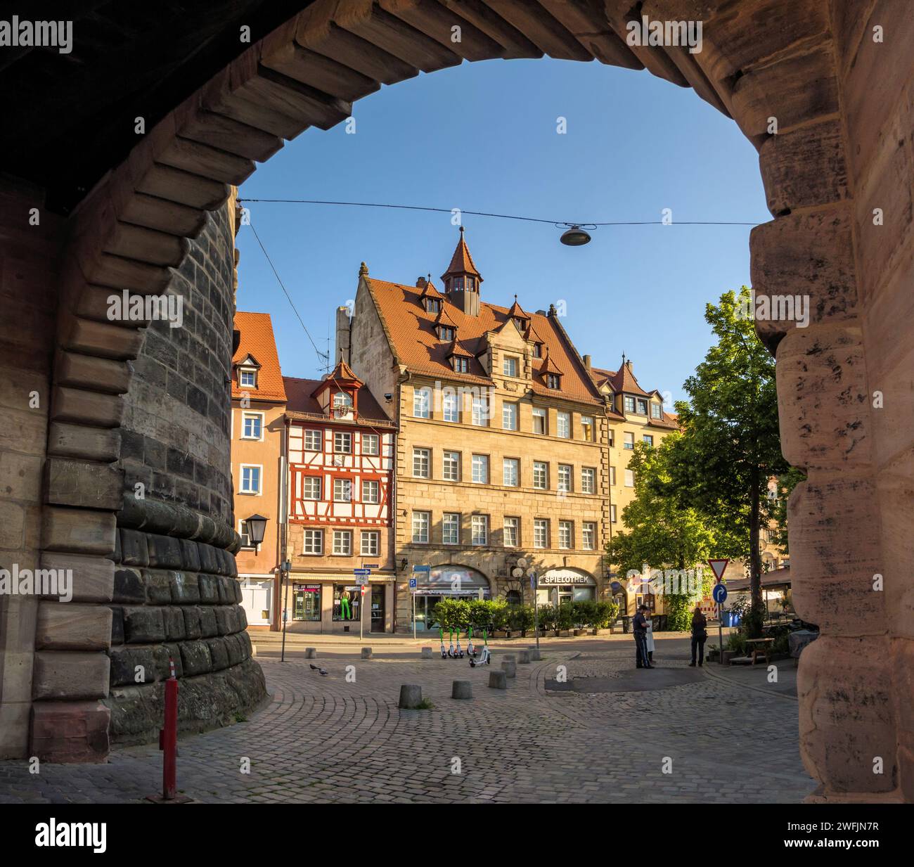View through archway at Spittlertor tower to old town houses in Ludwigsstraße in Nuremberg, Bavaria, Germany Stock Photo