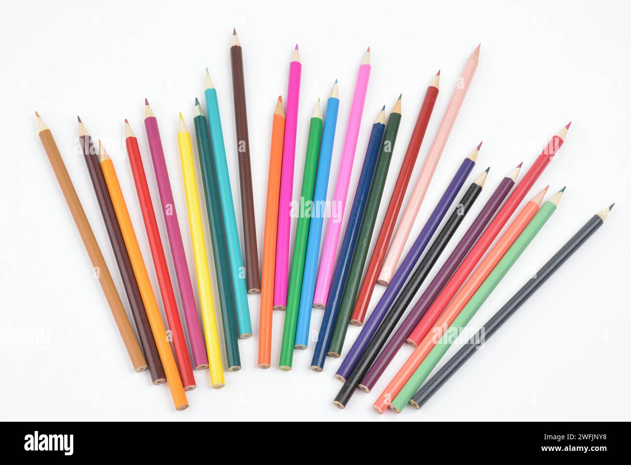 Collection of seamless coloured pencils lying loose, photographed on white background Stock Photo